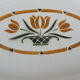 Plat ovale en faïence de Salins Terre fer motif vase avec tulipe L 37 cm
