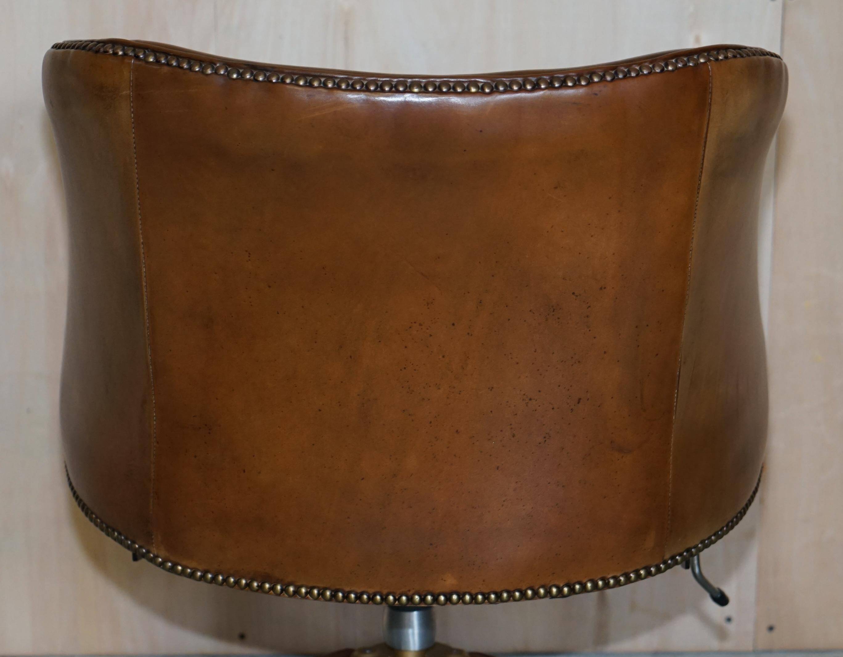 Vintage Patinated Leather Chesterfield Swivel Captain's Armchair