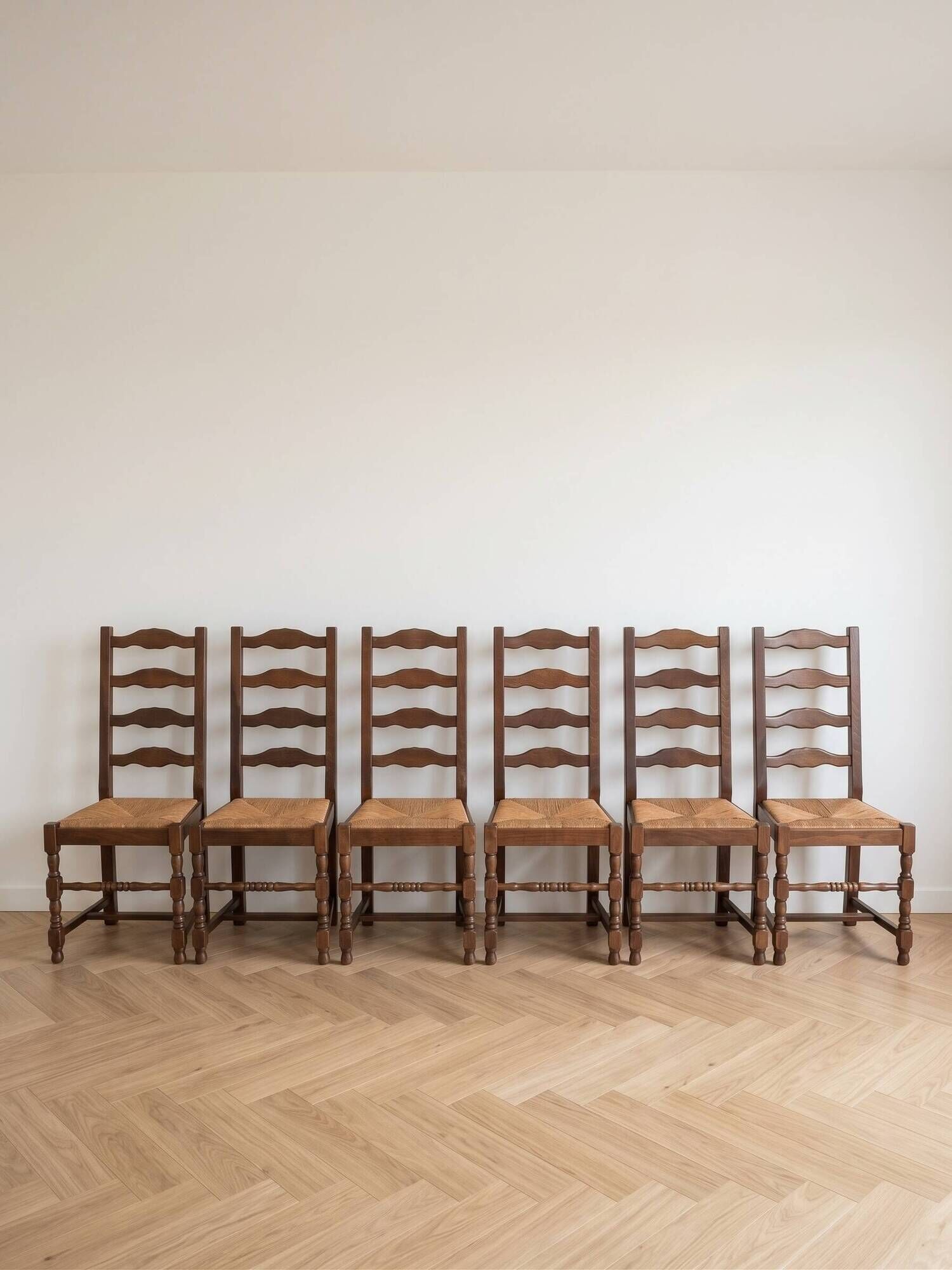 Set of 6 rustic wooden chairs with woven straw.