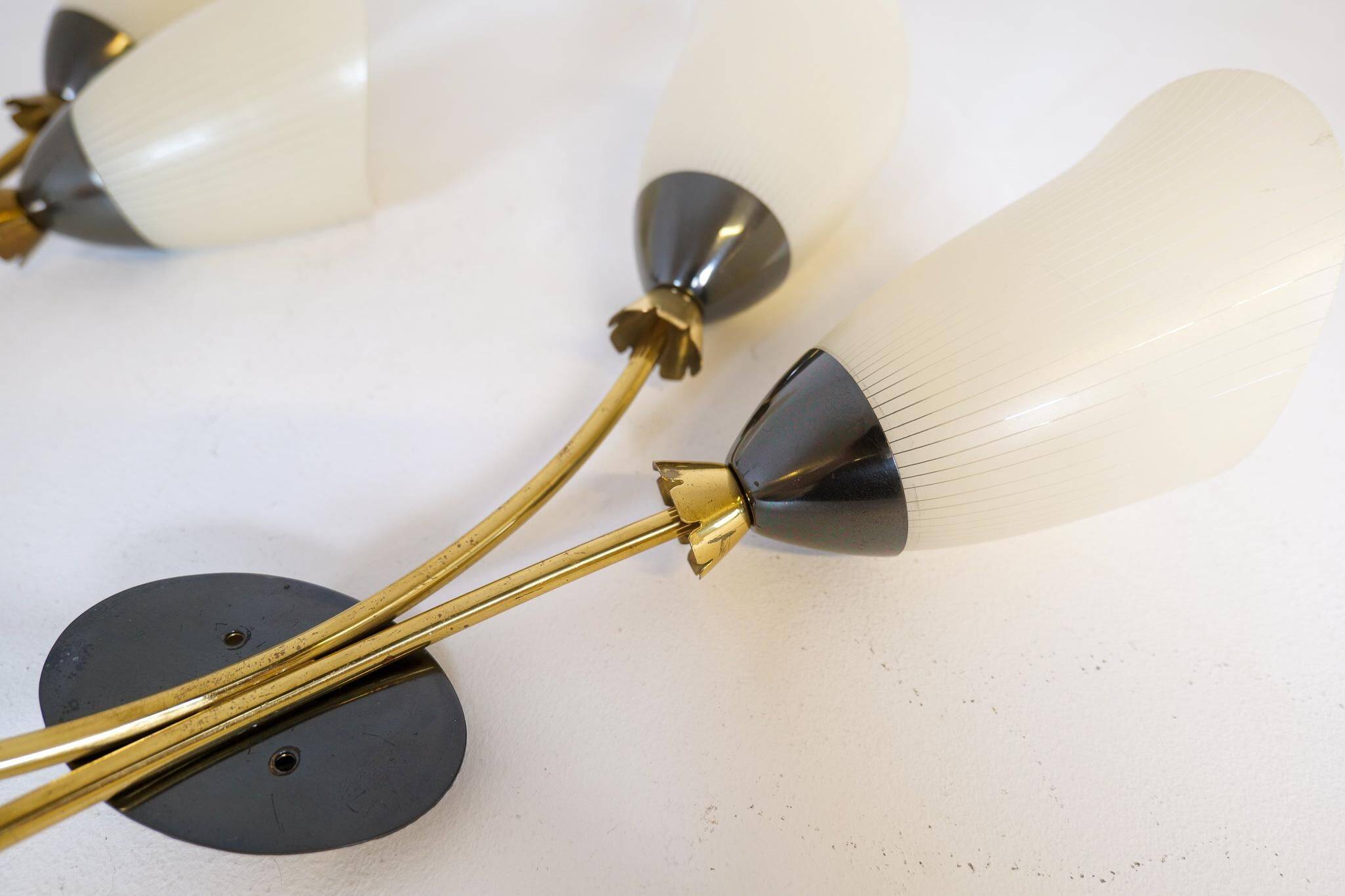 Mid-century pair of wall lamps in brass and opaline attributed to Asea Sweden, 1950s.