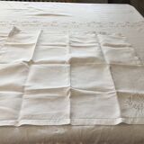 Table service with white handmade embroidery on linen canvas