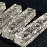 Set of 12 molded glass or crystal knife rests with diamond point decor
