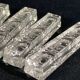 Set of 12 molded glass or crystal knife rests with diamond point decor