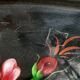 Black lacquered metal tray with multicoloured vintage Russian floral decoration.