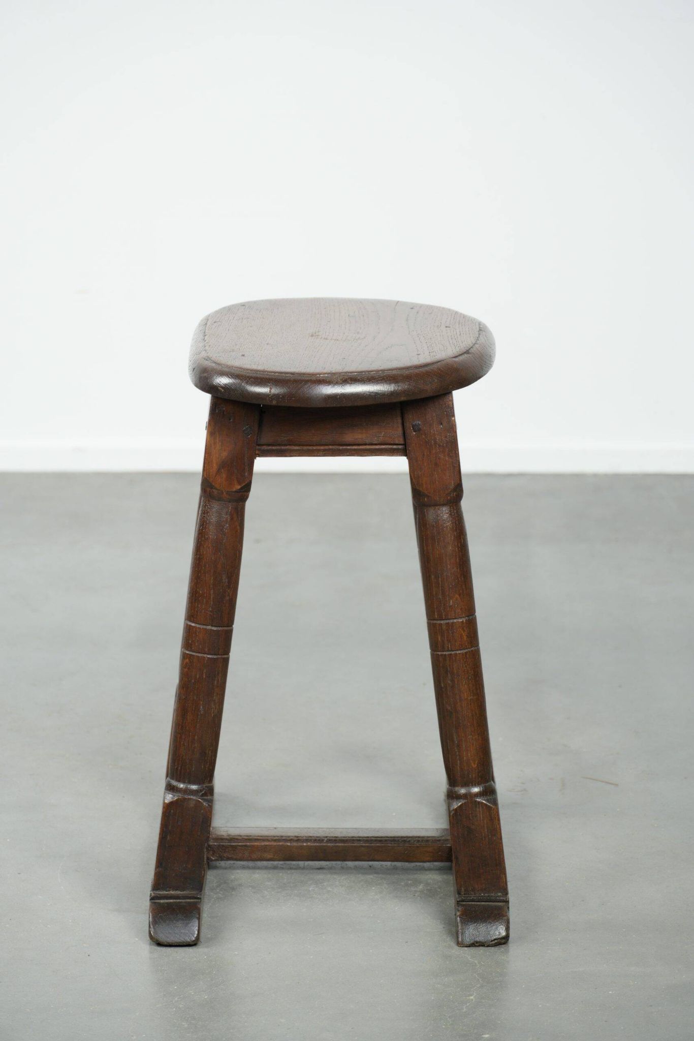Antique Dutch oak stool from the early 19th century with a nice design