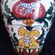 Art Deco ceramic vase with brightly colored abstract patterns