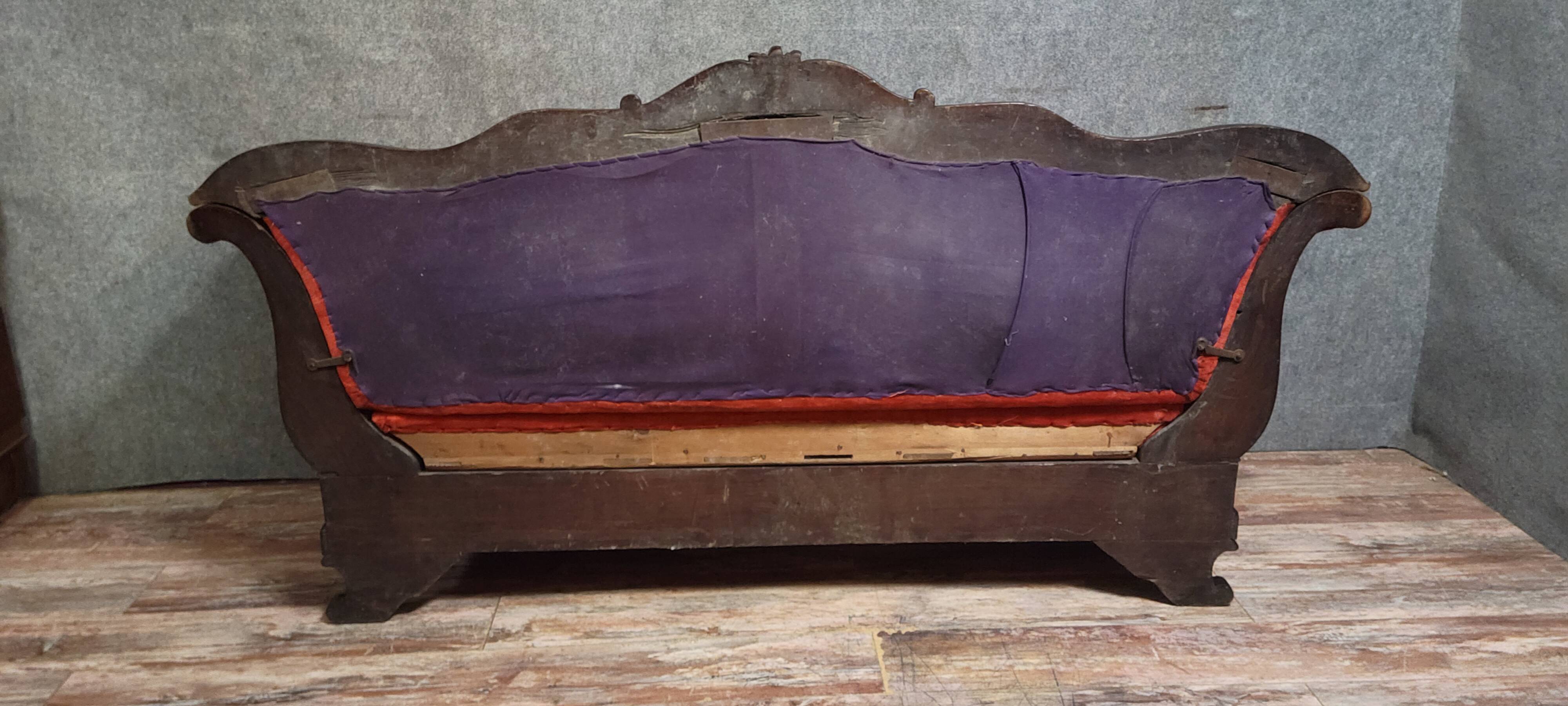 Sleeper or bench from the Charles X period in richly carved mahogany.