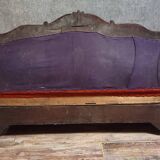 Sleeper or bench from the Charles X period in richly carved mahogany.
