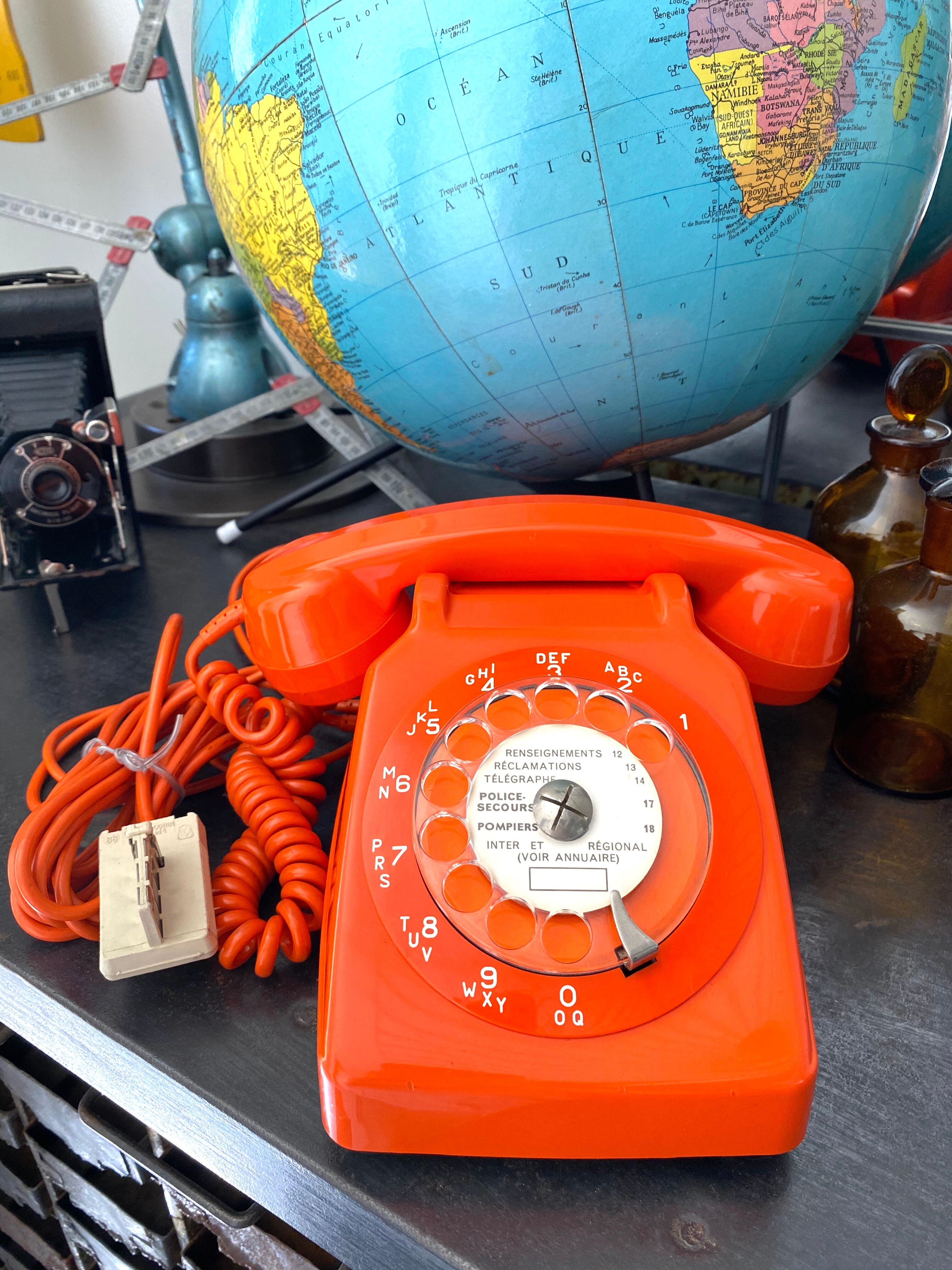Orange vintage dial phone