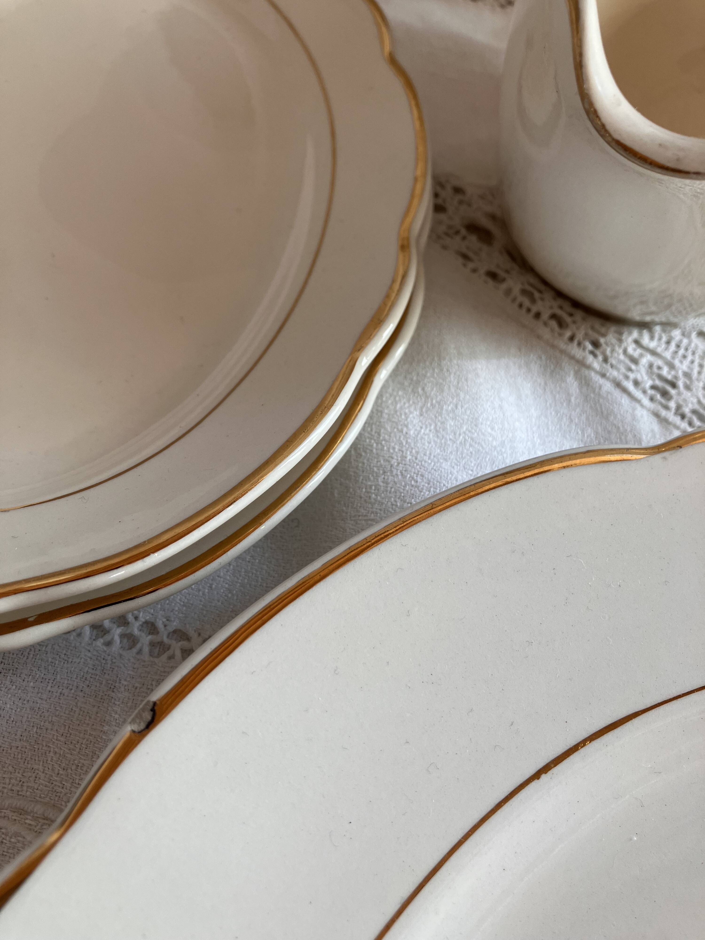 Service of 53 pieces of plates and dishes by Villeroy & Boch in cream and gold, model Saar.