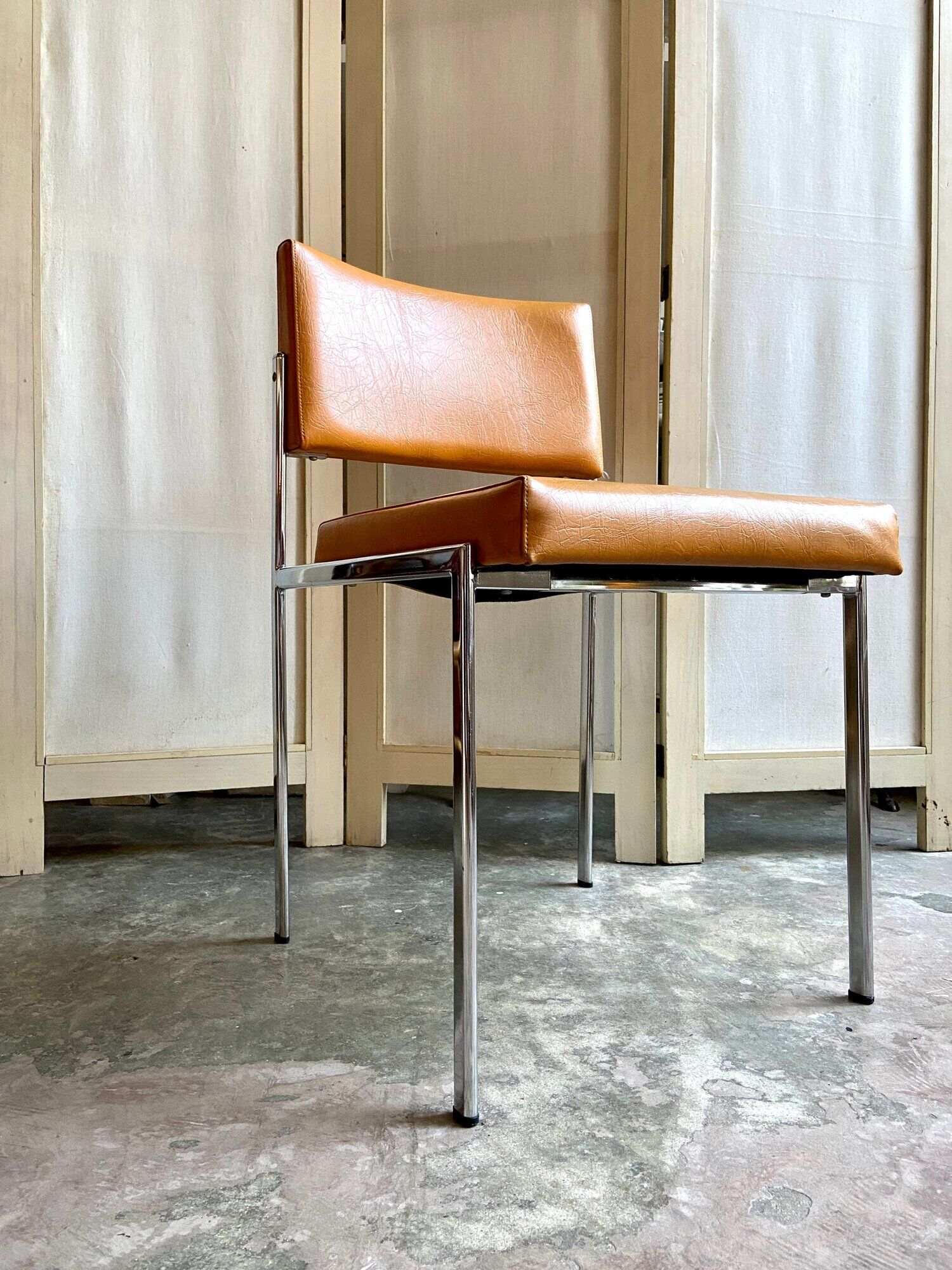Chair in chromed metal and ochre skaï 1970s