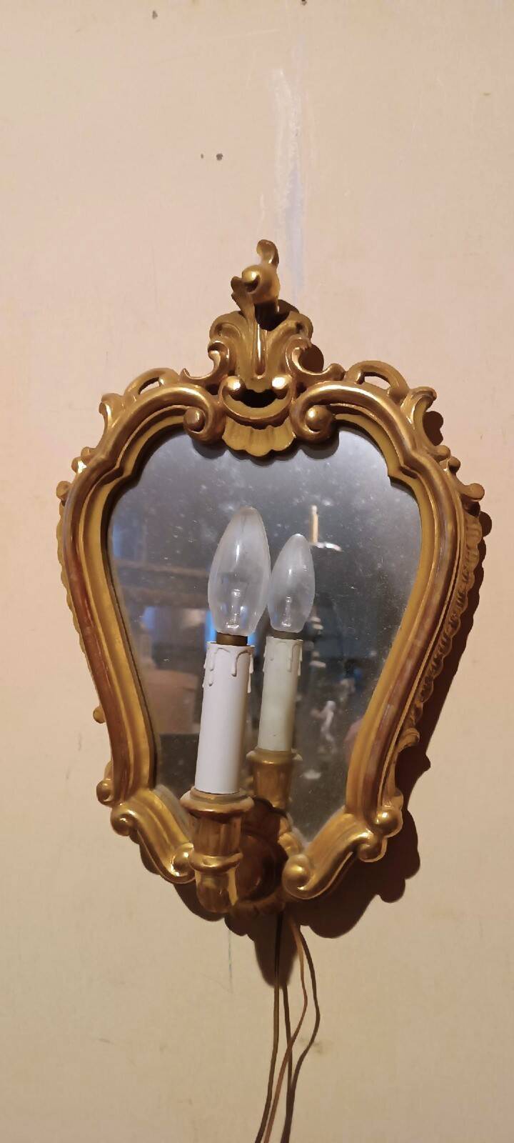 Vintage gold mirror sconces from the late 1950s.