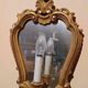 Vintage gold mirror sconces from the late 1950s.