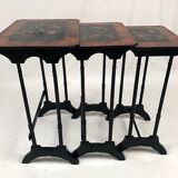 Series of three nesting tables, lacquer decorated with trendy birds and marquetry. circa 1900