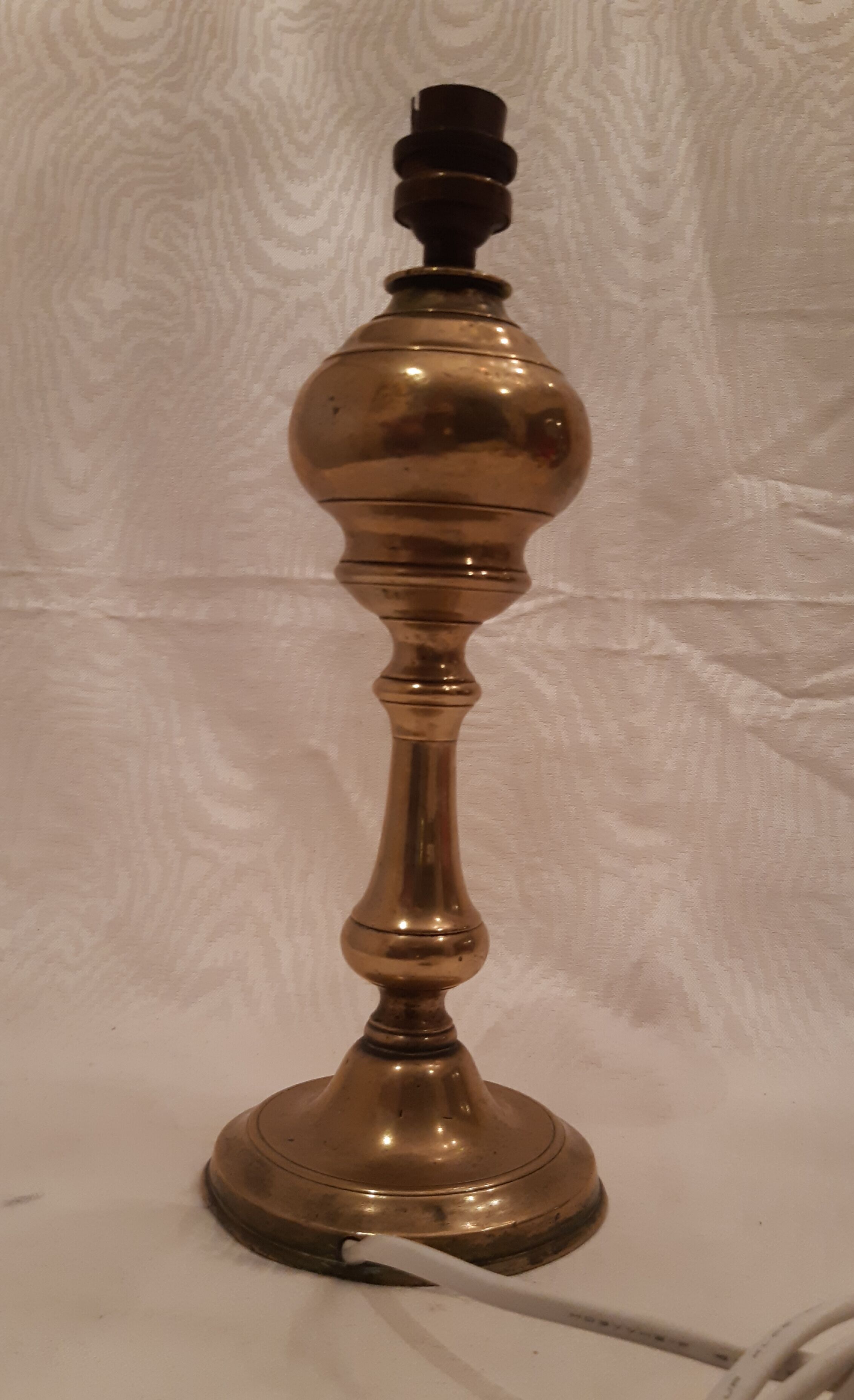 Old lamp foot in electrified brass
