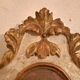 18th-century Italian mirror in gilded and painted wood.
