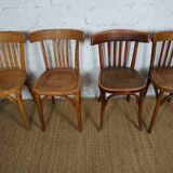 4 mismatched signed bistro chairs