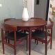 Four Danish mid-century teak armchairs.