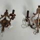 Pair of patinated wrought iron wall sconces with golden acanthus leaves and crystals.