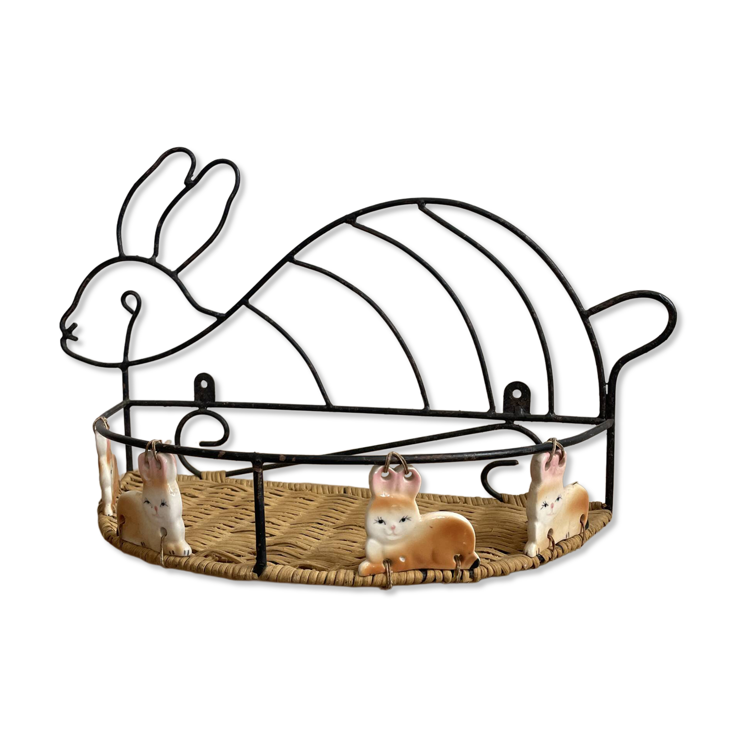 Wrought iron shelf and porcelain rabbit figurines