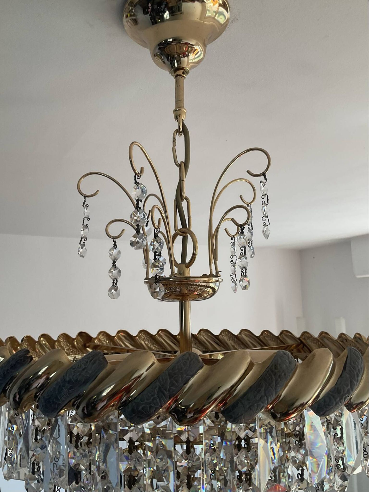 Crystal and brass chandelier with a cascade of pendants.
