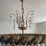 Crystal and brass chandelier with a cascade of pendants.