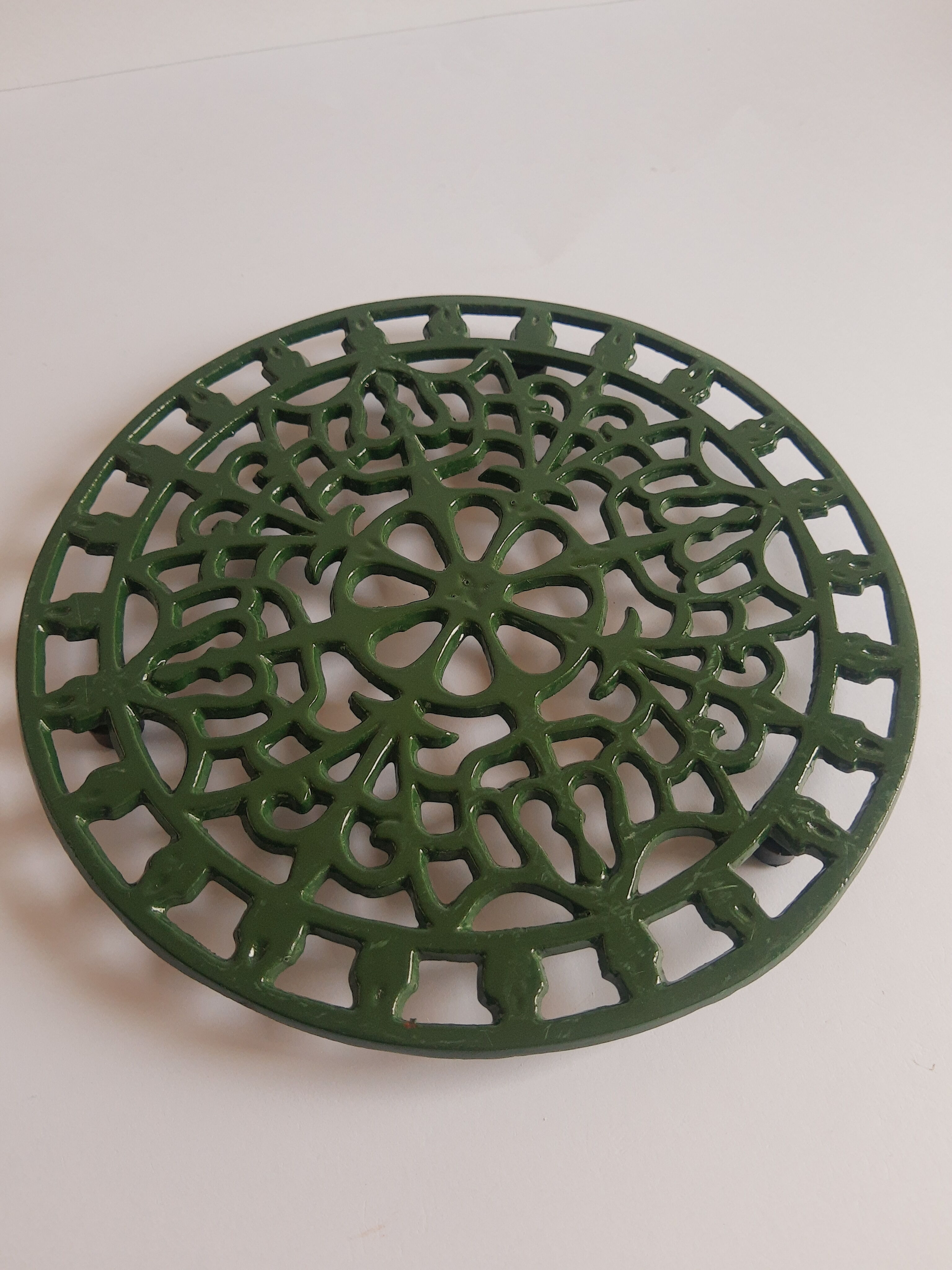 Vintage green cast iron trivet