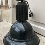 Black industrial pendant light in enameled sheet metal