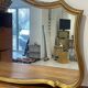 Large vintage mirror with an animated shape and Louis XV baroque style shell