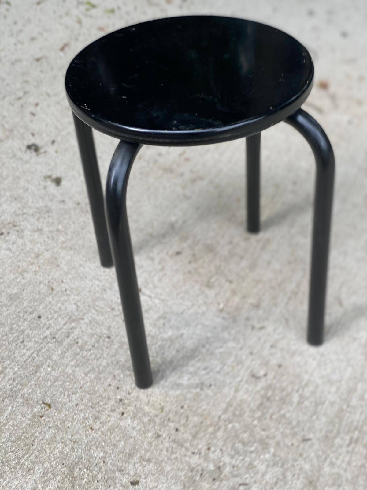 Black curved wooden stool