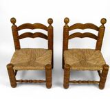 Pair of low straw chairs  circa 1940