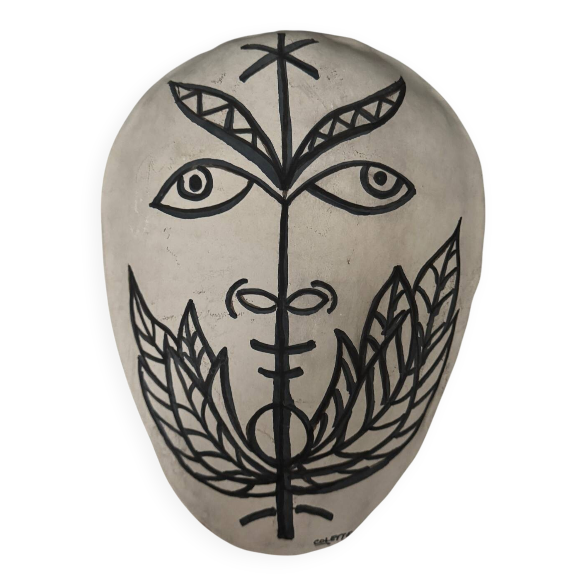 Africanist mask in glazed white terracotta, face signed Colette.