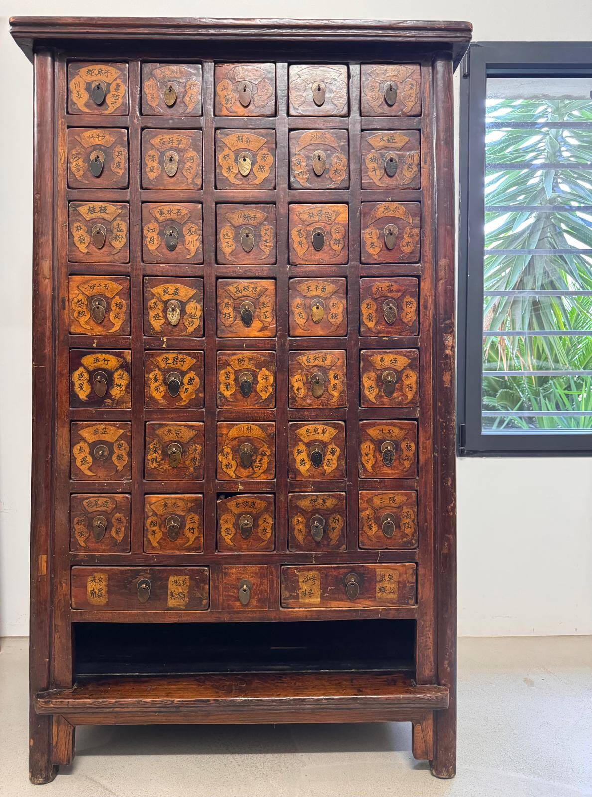 Apothecary cabinet with 38 drawers made of elm wood.
