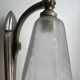 Silver Art Deco wall lights with frosted glass.