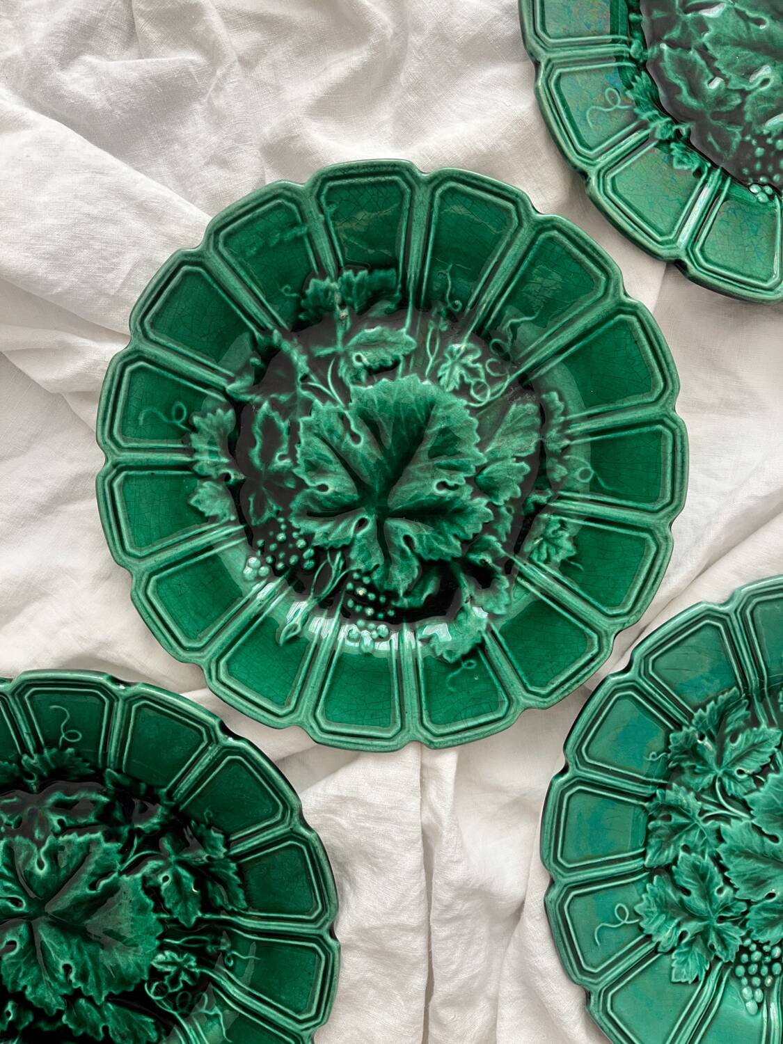4 old plates in Sarreguemines vine leaf slip