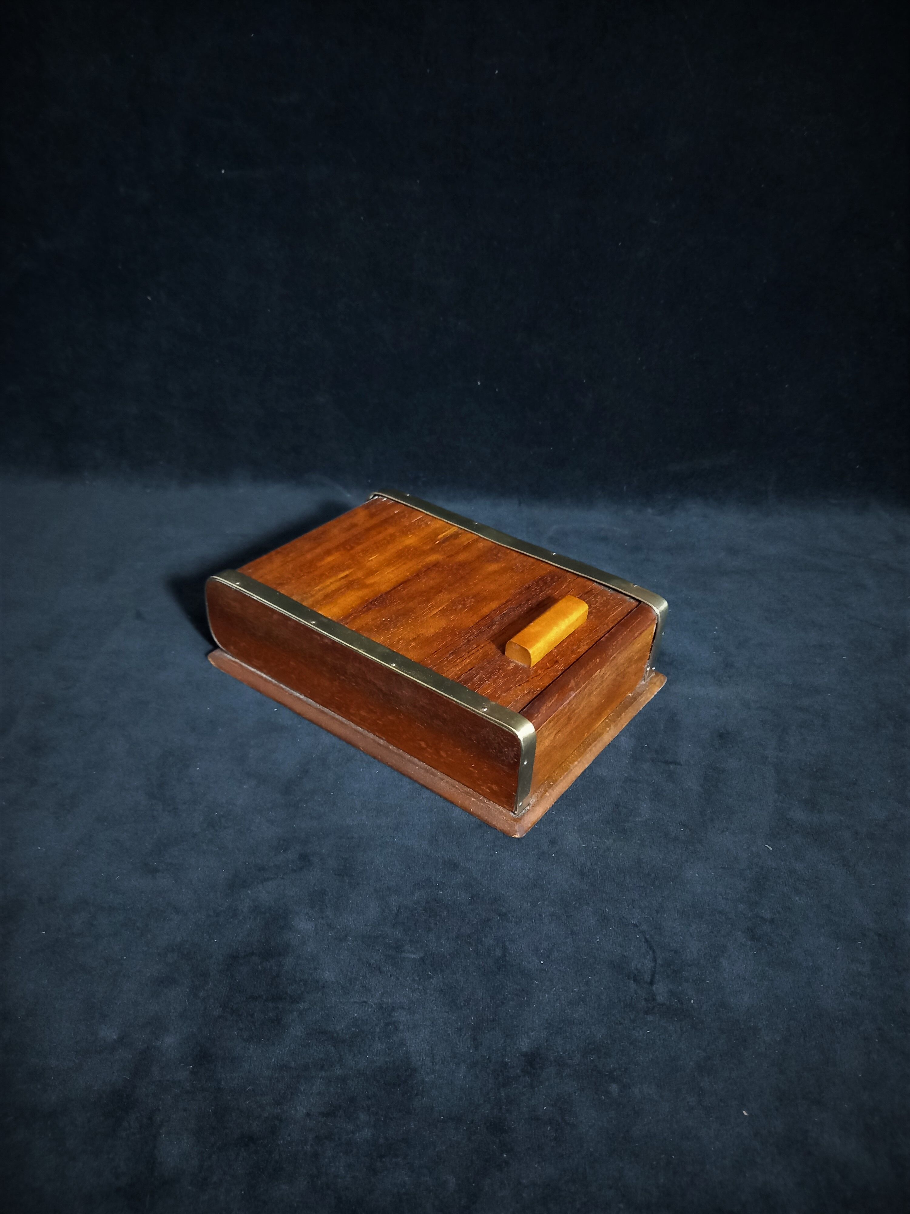 Art deco cigar box with sliding lid and brass finishes