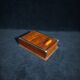 Art deco cigar box with sliding lid and brass finishes