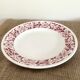 Round serving dish with burgundy red floral pattern