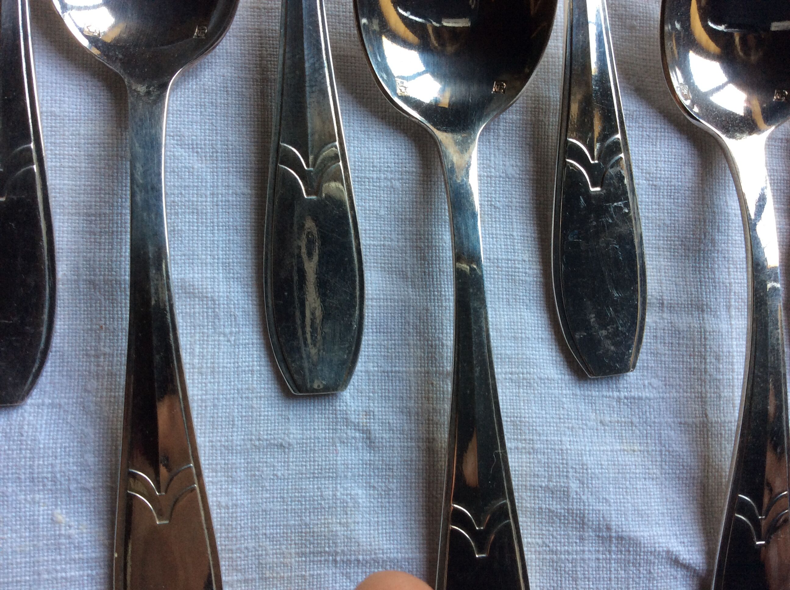 12 small art deco spoons, silver metal