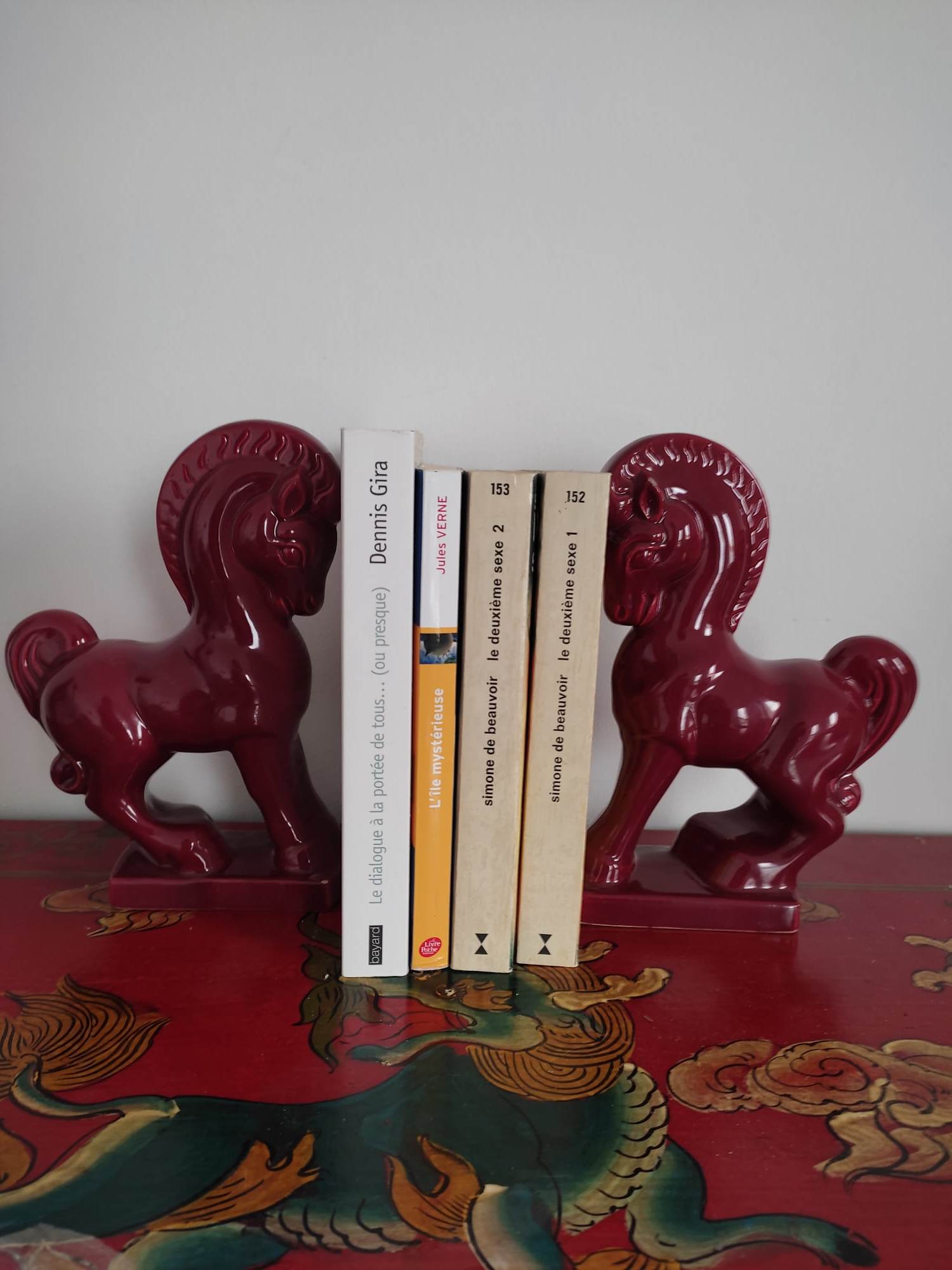 Pair of red porcelain horse bookends