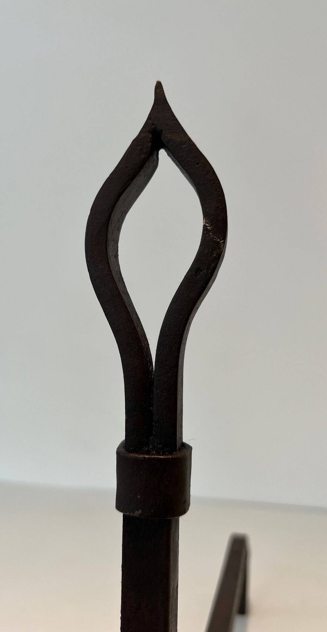 Pair of Modernist Andirons in Wrought Iron with Stylised Torches and Bases Ang