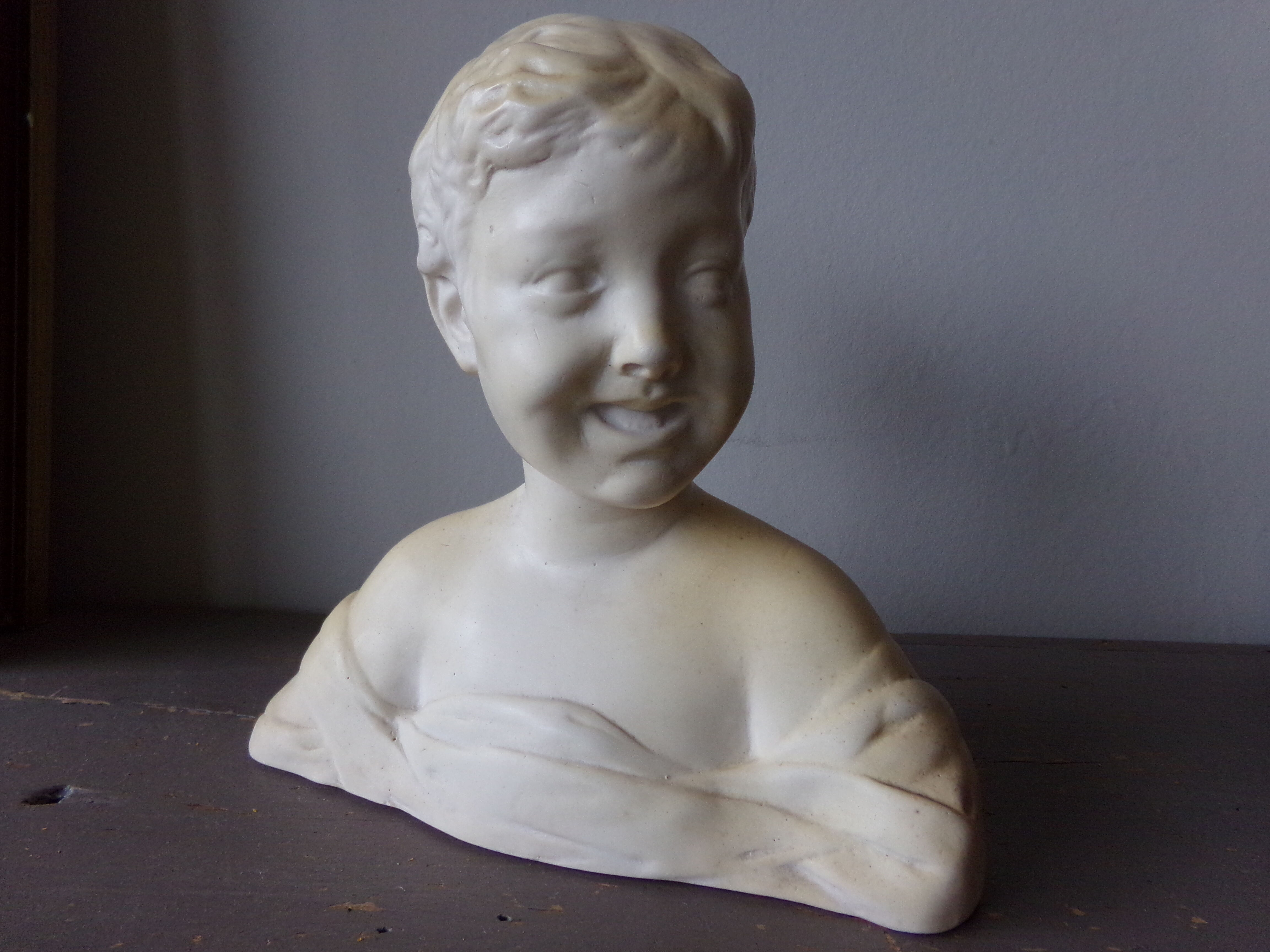 Bust of the laughing child