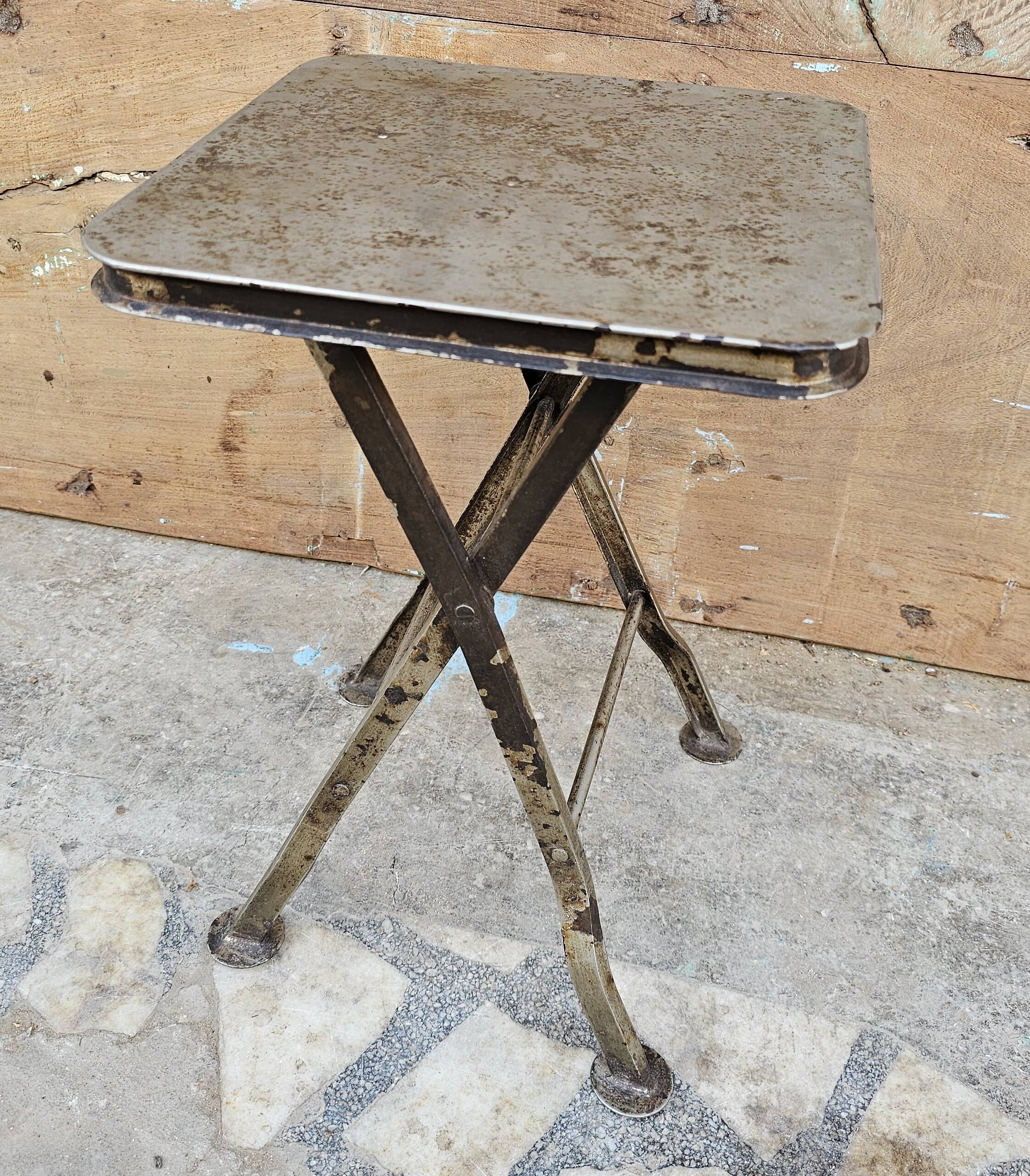 Old industrial folding steel stool