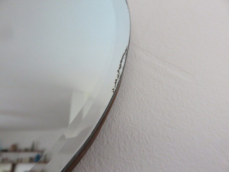 Beveled wall mirror, oval, on wood, with chain Art Deco years 30 40