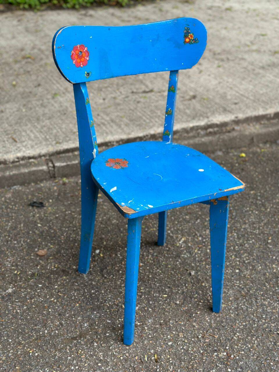 Child's chair in vintage or rustic wood style from the 1960s.