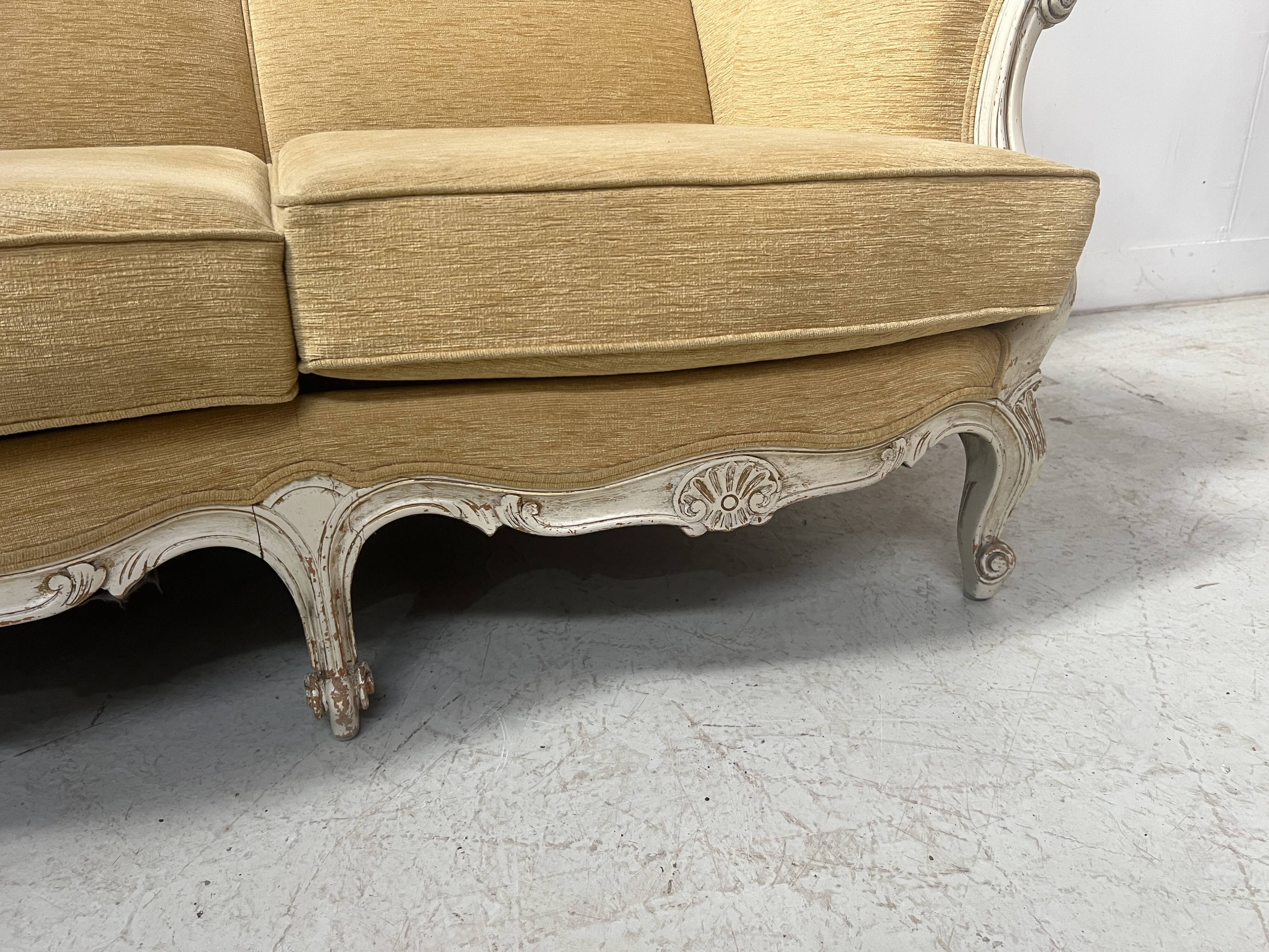 Louis XV style three-seater wingback sofa in patinated beech, 20th century