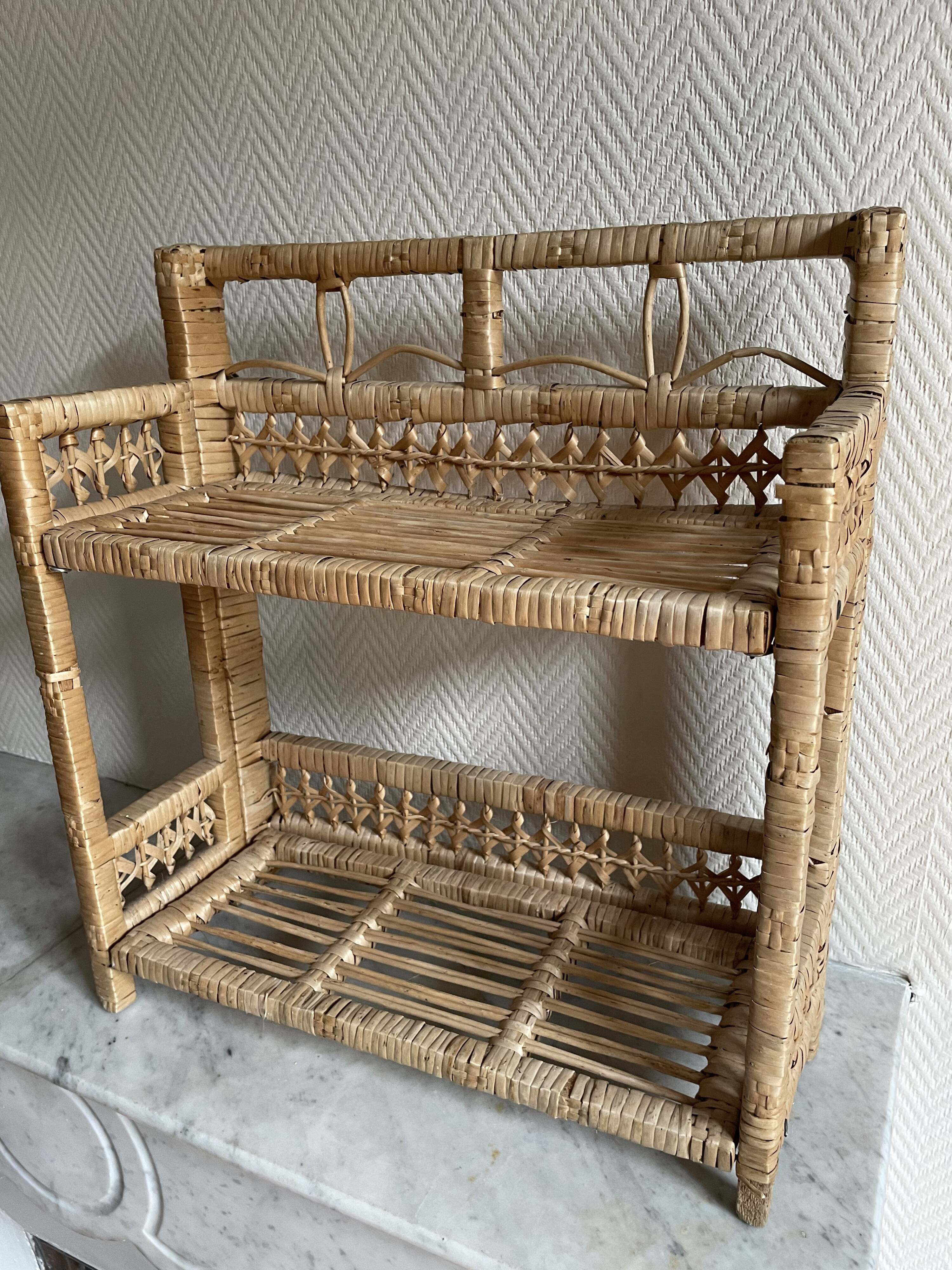 Small light beige wicker and rattan shelf