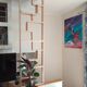 Two screens, partition walls, curved beech wood shelves.