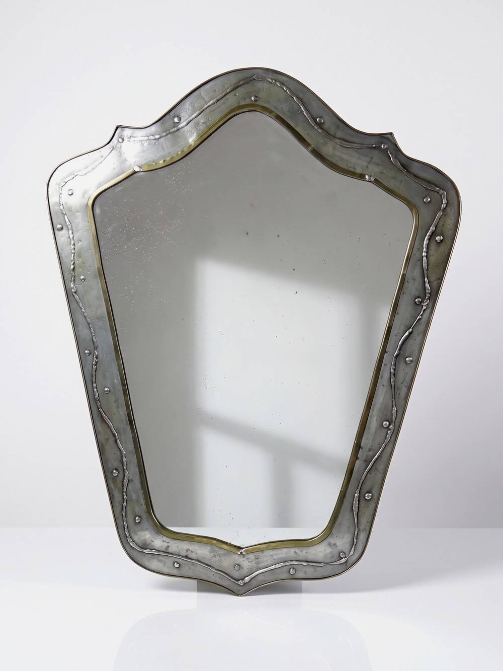 Brutalist mirror by Jean Goardère, brass and tin, 1970s.