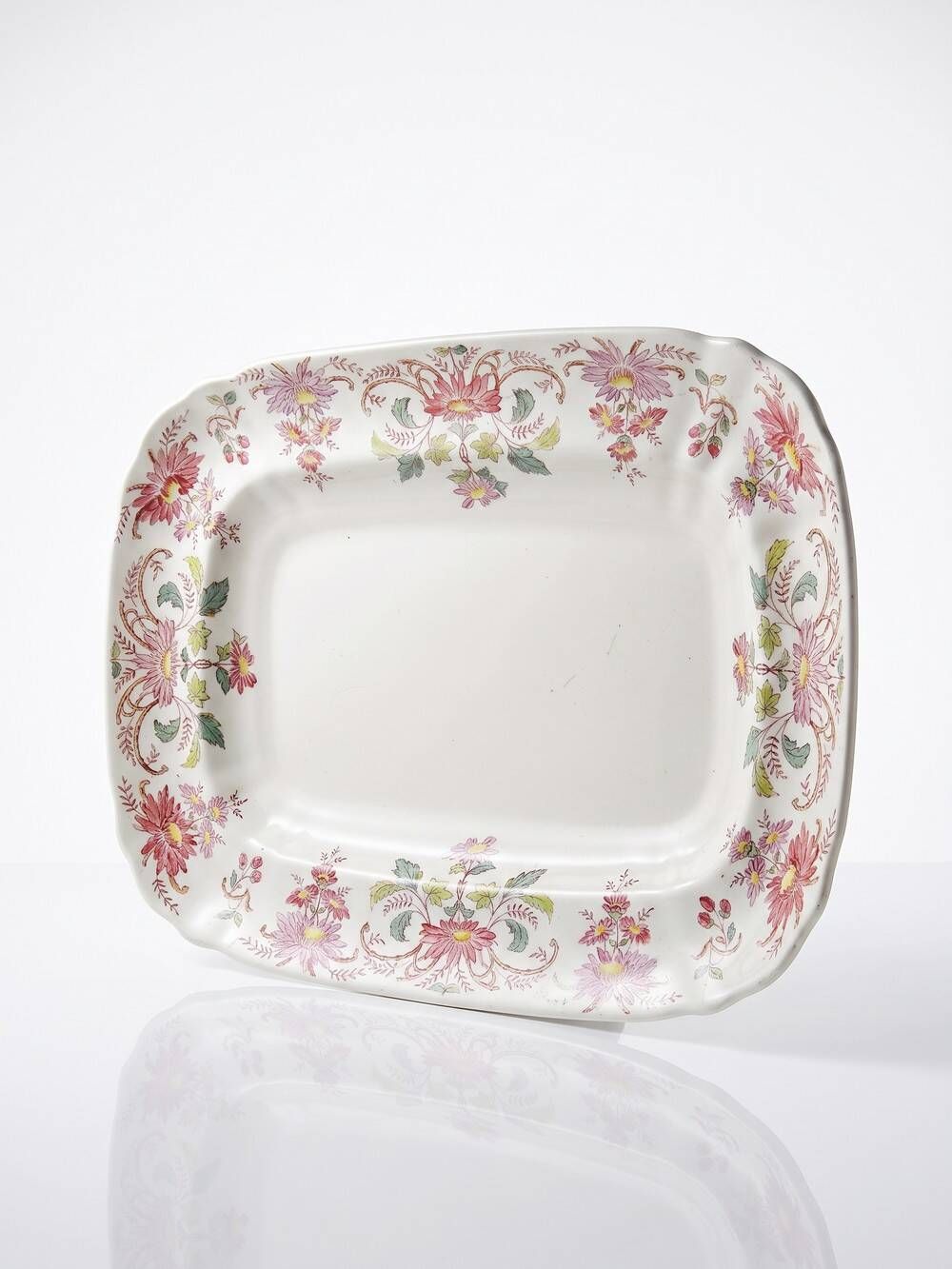 Antique Longchamp serving platter with polychrome daisies in ironstone.